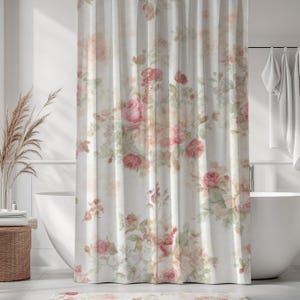 May include: A white shower curtain with a floral design of pink and peach roses and green foliage. The curtain hangs in front of a white bathtub. The style is vintage and romantic, suitable for a bathroom.