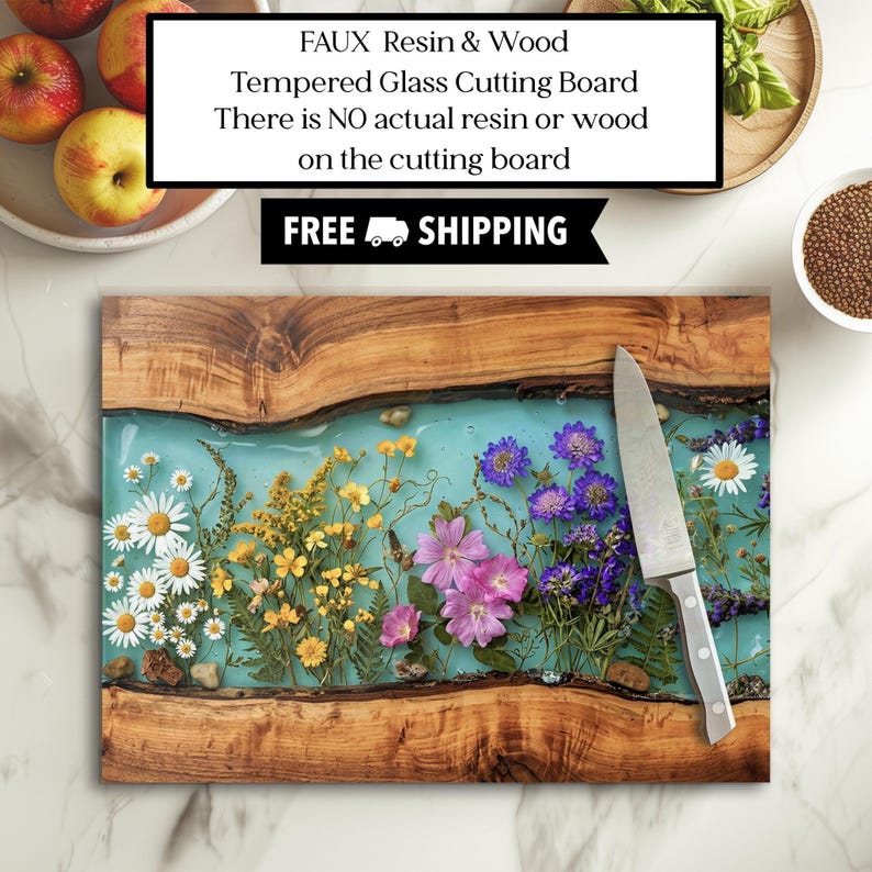 May include: A rectangular tempered glass cutting board with a faux resin and wood design. The center features a light blue hue with embedded flowers. A stainless steel knife rests on the board. The text on the image says "FAUX Resin & Wood Tempered Glass Cutting Board There is NO actual resin or wood on the cutting board".