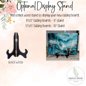 May include: A black wood display stand for cutting boards. The image shows a cutting board with a blue and gold design on a stand. Text on the image reads "Optional Display Stand" and "Black Wood."