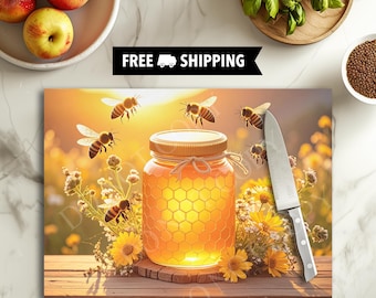 May include: A decorative cutting board featuring a jar of honey with a honeycomb design, surrounded by bees and yellow flowers. A knife rests on the board. The words "FREE SHIPPING" are displayed above the board.
