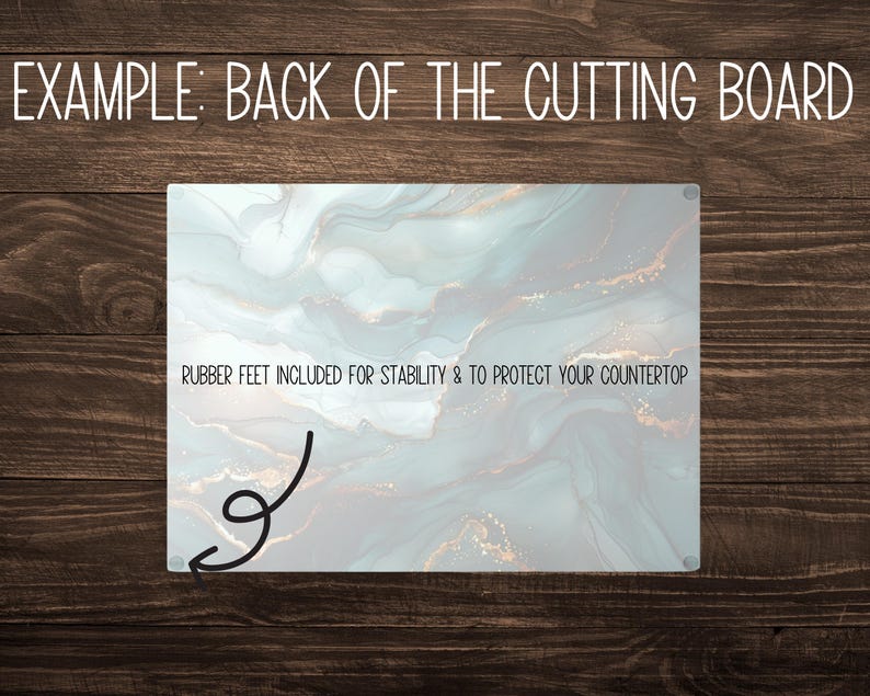 May include: A rectangular cutting board with a marbled design in shades of blue, gray, and gold. The text "RUBBER FEET INCLUDED FOR STABILITY & TO PROTECT YOUR COUNTERTOP" is printed on the board.