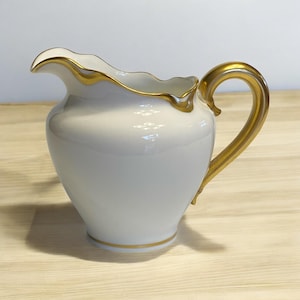 Antyczna śmietanka Haviland Limoges: porcelana Blanc de Chine z obramowaniem w kolorze złota
