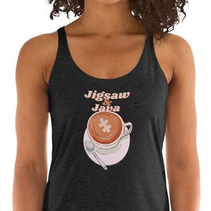 May include: A black tank top with a graphic of a coffee cup with a puzzle piece in the foam. The text "Jigsaw Java" is above the cup.
