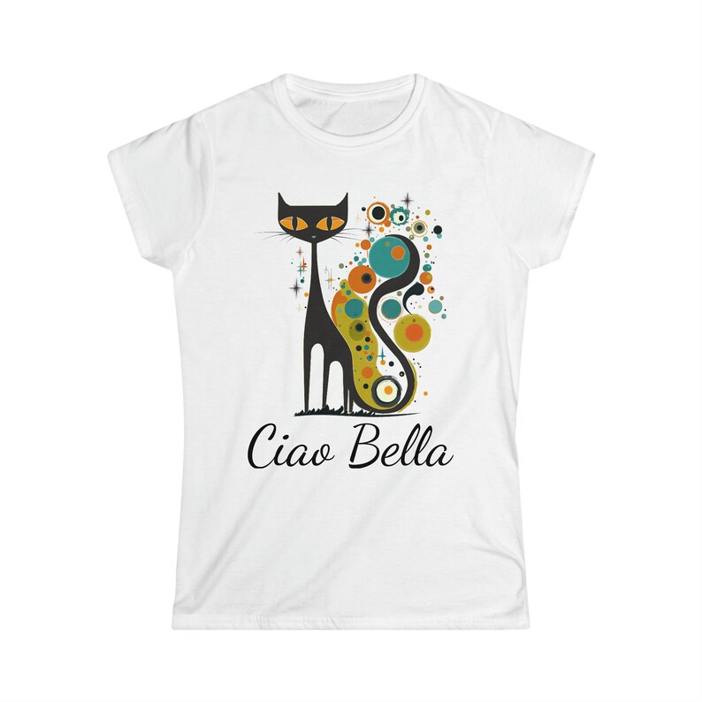 May include: White t-shirt featuring a stylized black cat with orange eyes and a colorful abstract design. The text "Ciao Bella" is printed in black script below the cat illustration. A fun and stylish graphic tee.