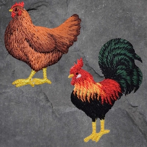 May include: Embroidered patches of a brown hen and a red rooster with a green tail. The hen is standing on a grey surface. The rooster is standing on a grey surface.