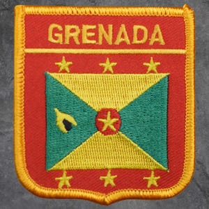 May include: Embroidered patch featuring the flag of Grenada. The patch has a red border and background with the word "GRENADA" in gold. The flag design includes yellow, green, and red elements, with stars.