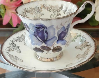 Vintage Royal Windsor Bone China theekop en schotel: blauwe roos, zilveren rand