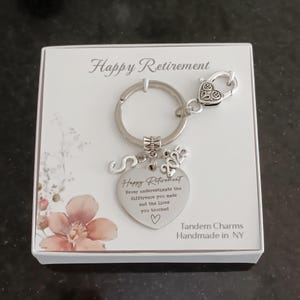 keychain with 'Happy Retirement' floral card