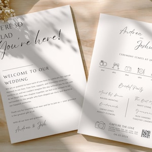 May include: Two white wedding programs with black text. One reads "We're so glad you're here!" and "Welcome to our wedding." The other lists the ceremony details, bridal party, and a QR code. The programs are on a wooden surface.