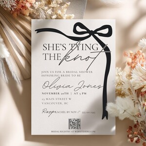 shes tying the knot wedding shower or bachelorette party invitation editable and printable template. black and white with black coquette bow and QR code for bridal shower registry