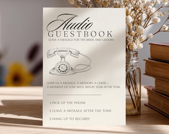 May include: Cream-colored Audio Guestbook sign with a vintage telephone illustration. Text includes "Leave a message for the bride and groom" and instructions: Pick up the phone, leave a message, and hang up.