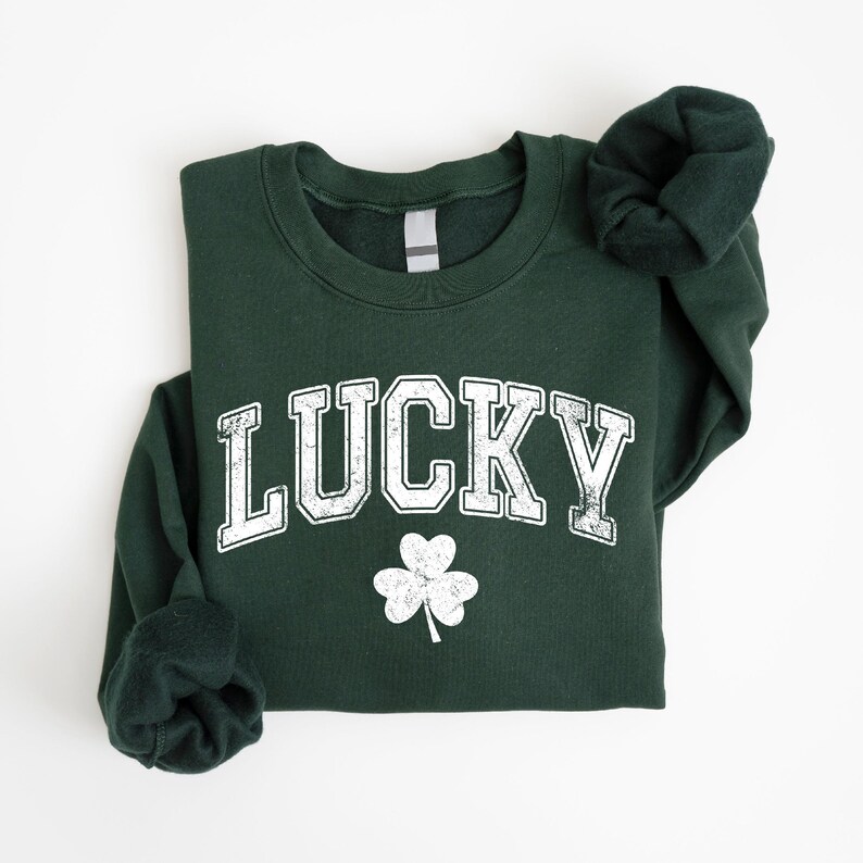 a green sweatshirt with a shamrock on it