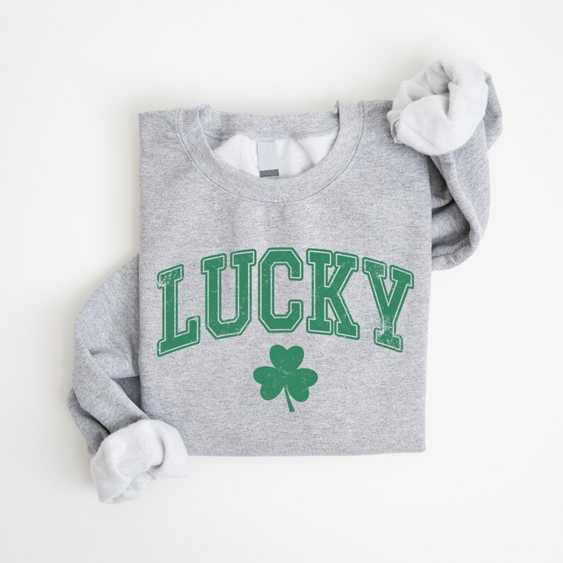 a sweatshirt with a shamrock on it that says lucky
