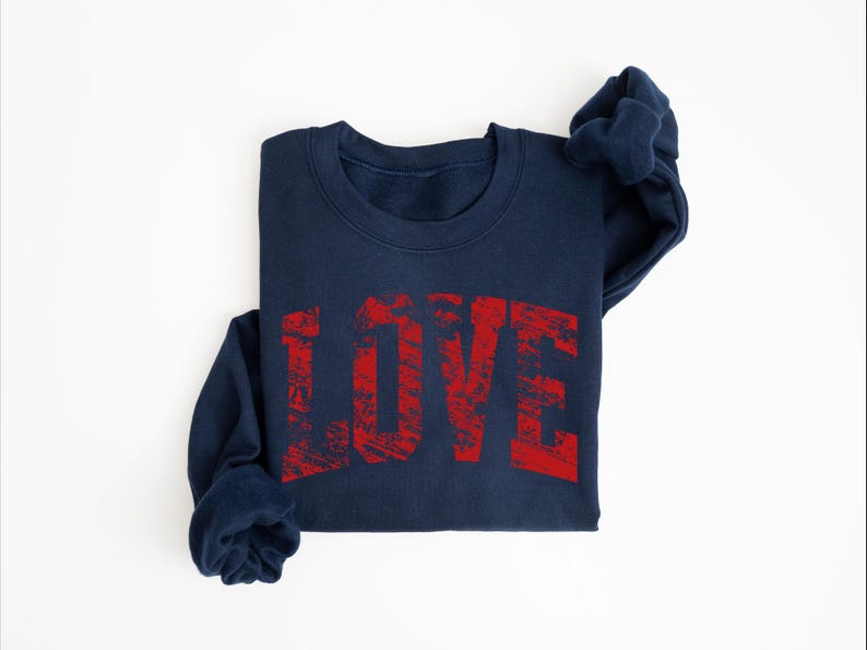 A navy blue sweatshirt with the word "LOVE" printed in red text on it.