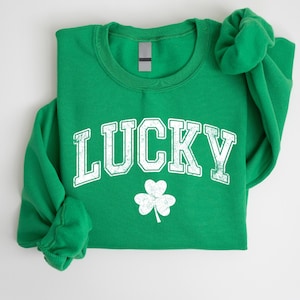 a green shirt with a shamrock on it
