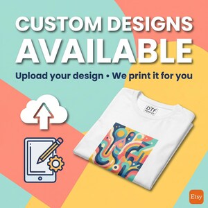May include: White t-shirt with a colorful abstract design, folded on a yellow and teal background. The image includes the text "CUSTOM DESIGNS AVAILABLE" and "Upload your design &bull; We print it for you."