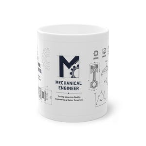 Puede incluir: Una taza de cerámica blanca con ilustraciones técnicas y texto en azul oscuro. El diseño incluye una letra M grande, un diagrama de pistón, iconos de engranajes y el texto Mechanical Engineer, Turning Ideas into Reality, Engineering a Better Tomorrow.