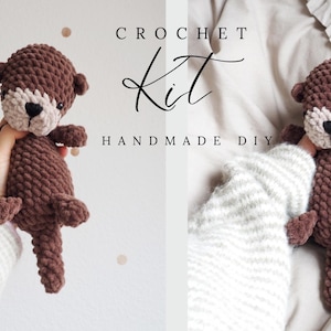 May include: A handmade crochet otter in shades of brown, with a cream-colored face and a black nose. The image includes the text "CROCHET Kit HANDMADE DIY".