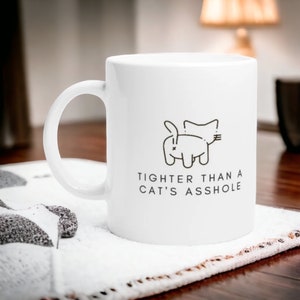 Tighter than a cats ass Mug