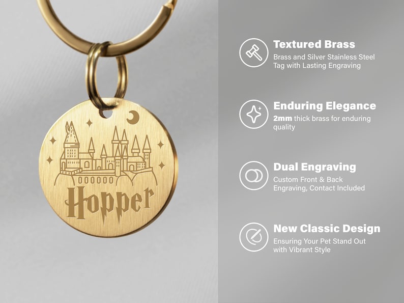 May include: A gold-toned pet ID tag featuring a Hogwarts castle design and the name "Hopper" engraved on it. The tag is attached to a silver key ring. The tag is made from textured brass and is 2mm thick for durability. It offers dual engraving, allowing for personalisation on both sides.