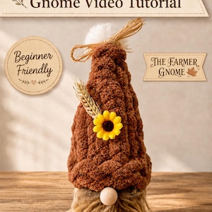 May include: A chunky hand knit gnome with a brown textured hat, a white pom-pom, a wooden bead nose, and a long tan faux fur beard. The hat is decorated with a yellow sunflower and a wheat stalk. Text reads Wistfully Woven's Chunky Hand Knit Gnome Video Tutorial, Beginner Friendly, and The Farmer Gnome.