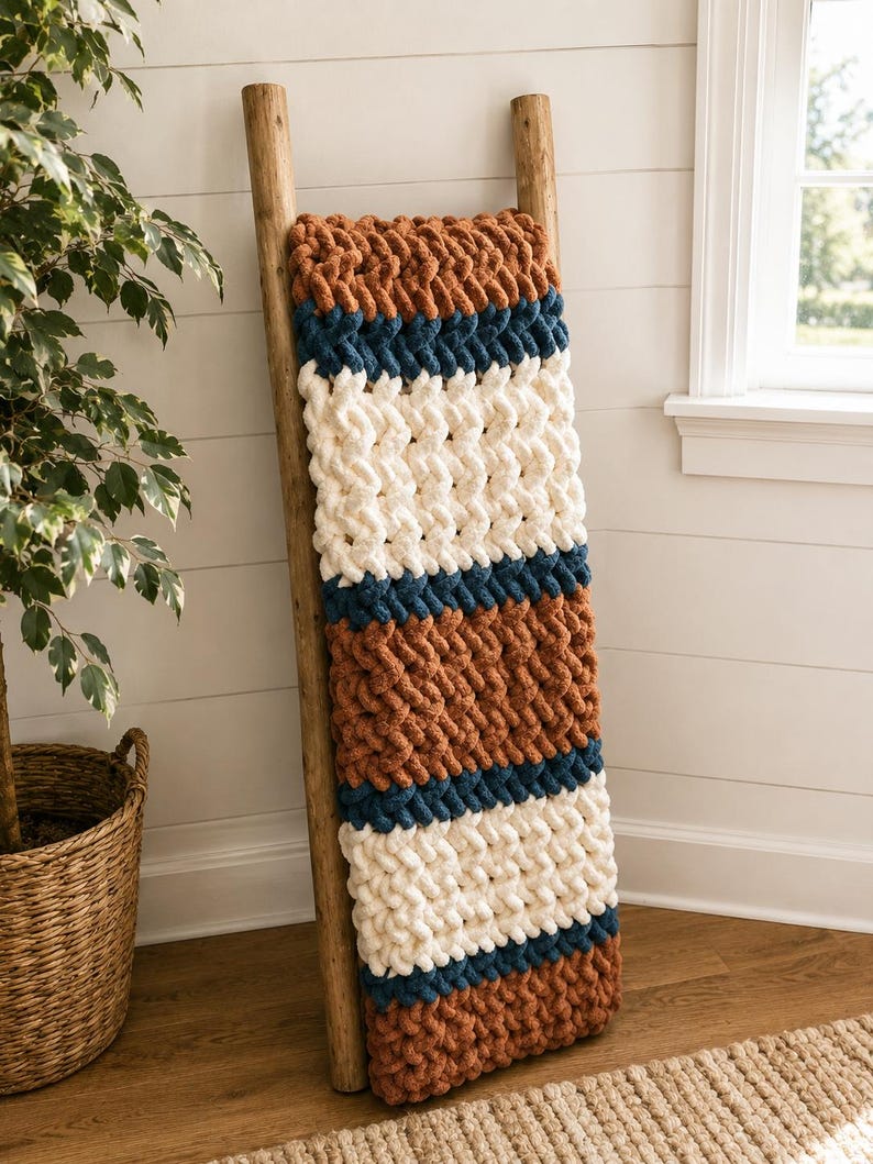 Beginner-friendly chunky hand knit blanket video tutorial by Wistfully Woven featuring the Rustic Barn Weave stitch pattern in a soft sky blue color. Digital PDF download includes a 15+ minute step-by-step YouTube tutorial teaching how to make a cozy chunky knit blanket from cast on to cast off.