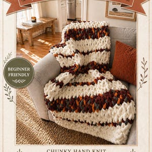 May include: A chunky hand-knitted blanket pattern in cream, burgundy, grey, and orange is draped over a grey sofa. The words "Fireside Embers" are at the top, and "Beginner Friendly" is in a circle. The text "Chunky Hand Knit Blanket Pattern by Wistfully Woven" is at the bottom.