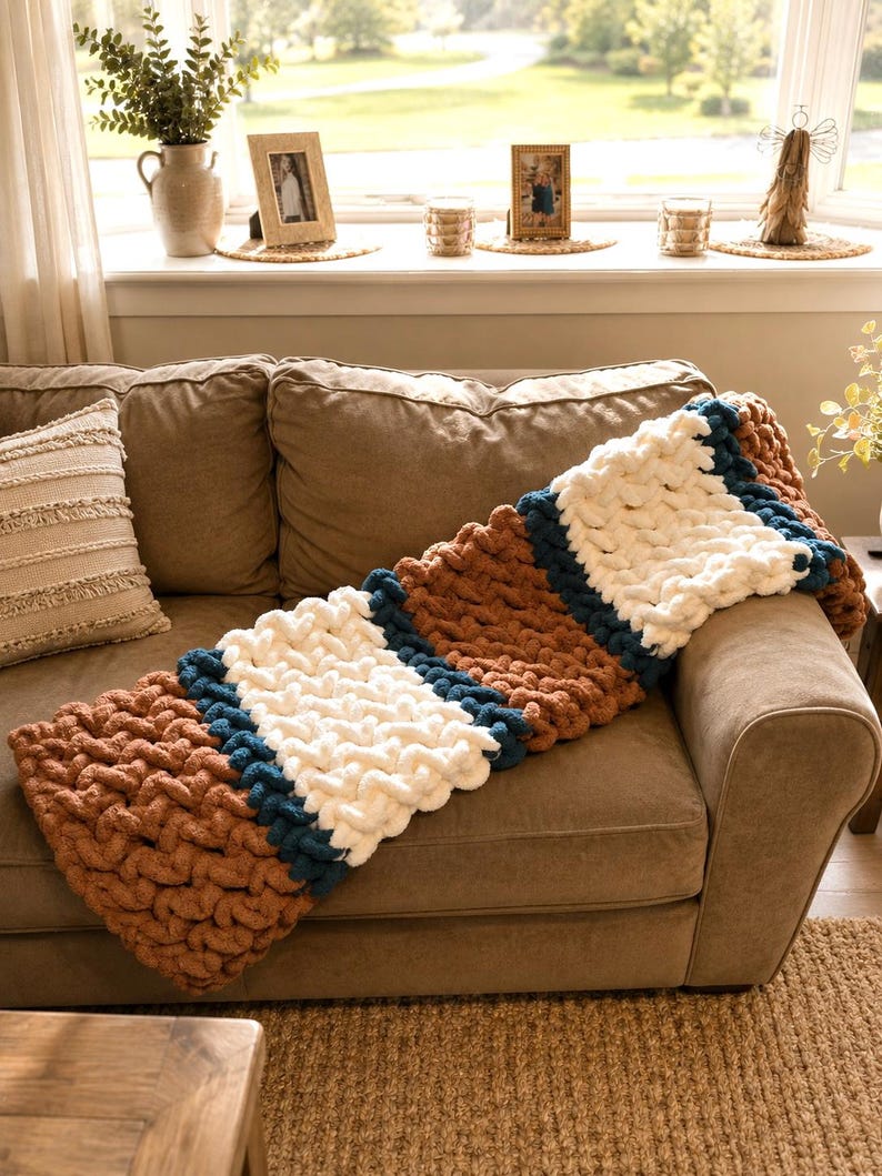 Beginner-friendly chunky hand knit blanket video tutorial by Wistfully Woven featuring the Rustic Barn Weave stitch pattern in a soft sky blue color. Digital PDF download includes a 15+ minute step-by-step YouTube tutorial teaching how to make a cozy chunky knit blanket from cast on to cast off.