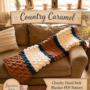 May include: A chunky hand-knit blanket in shades of brown, white, and navy blue rests on a brown sofa. The blanket features a striped design. The words "Country Caramel" are displayed on a banner above the sofa. The image also includes text that reads "Chunky Hand Knit Blanket PDF Pattern".