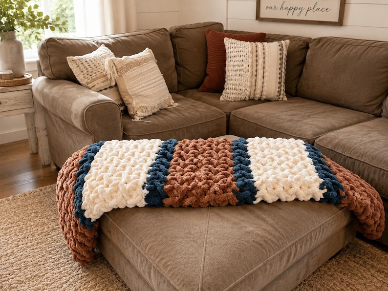 Beginner-friendly chunky hand knit blanket video tutorial by Wistfully Woven featuring the Rustic Barn Weave stitch pattern in a soft sky blue color. Digital PDF download includes a 15+ minute step-by-step YouTube tutorial teaching how to make a cozy chunky knit blanket from cast on to cast off.