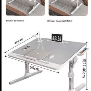 May include: A grey and white adjustable laptop desk with a drawer and a USB port. The desk is 60 cm wide and 40 cm deep, with an adjustable height of 27-40 cm. It features a digital clock displaying 05:20.