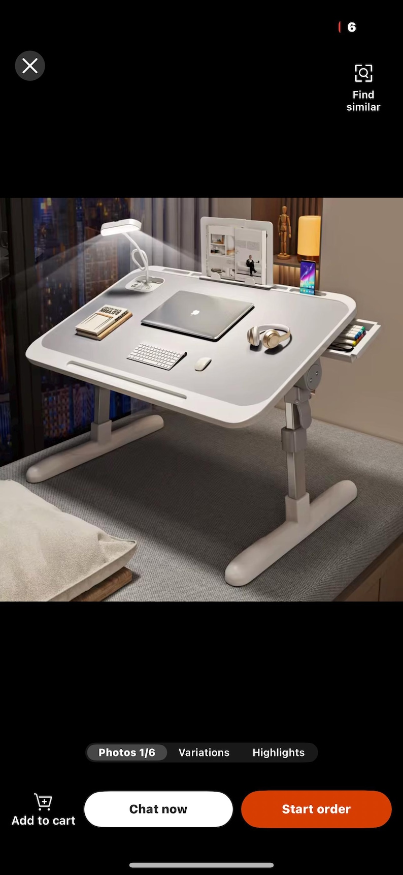 May include: An adjustable laptop desk in white and grey, featuring a built-in lamp, laptop, and keyboard. The desk includes a drawer and is designed for work or study. The desk is supported by a white frame.