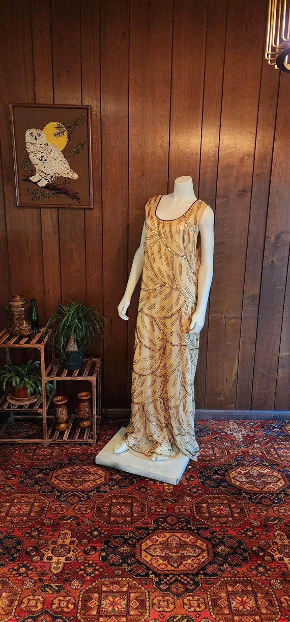 Floor-length gold sequence & beaded dress