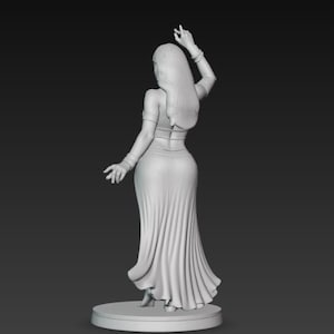 May include: A grayscale 3D-printed figurine of a woman in a flowing dress, arms raised in a dance pose. The figure has long hair and is standing on a circular base. The dress has detailed folds.