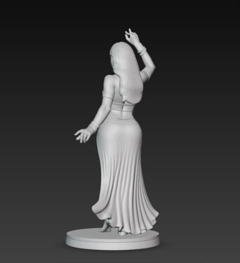 May include: A grayscale 3D-printed figurine of a woman in a flowing dress, arms raised in a dance pose. The figure has long hair and is standing on a circular base. The dress has detailed folds.