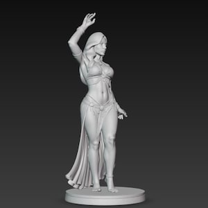 May include: A grayscale figurine of a woman in a belly dance costume, with her arm raised. The figure is standing on a circular base, with a long skirt and jewelry. The statue is a detailed representation of a dancer.
