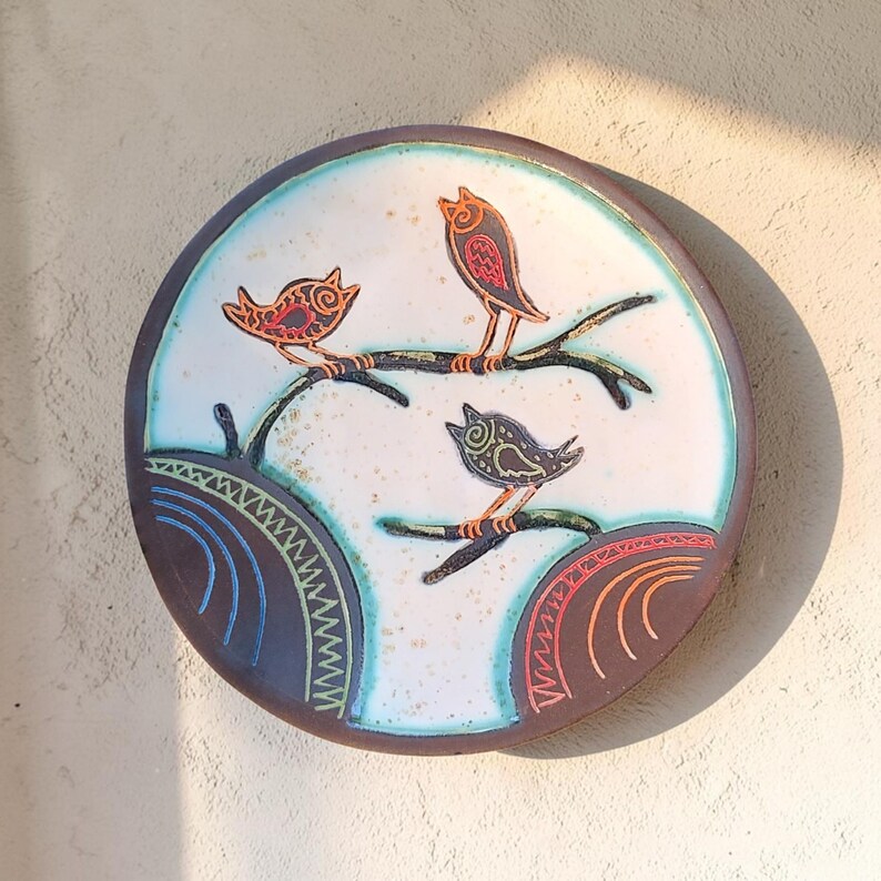 handmade ceramic bird wall plate hanging on wall minimalist decor