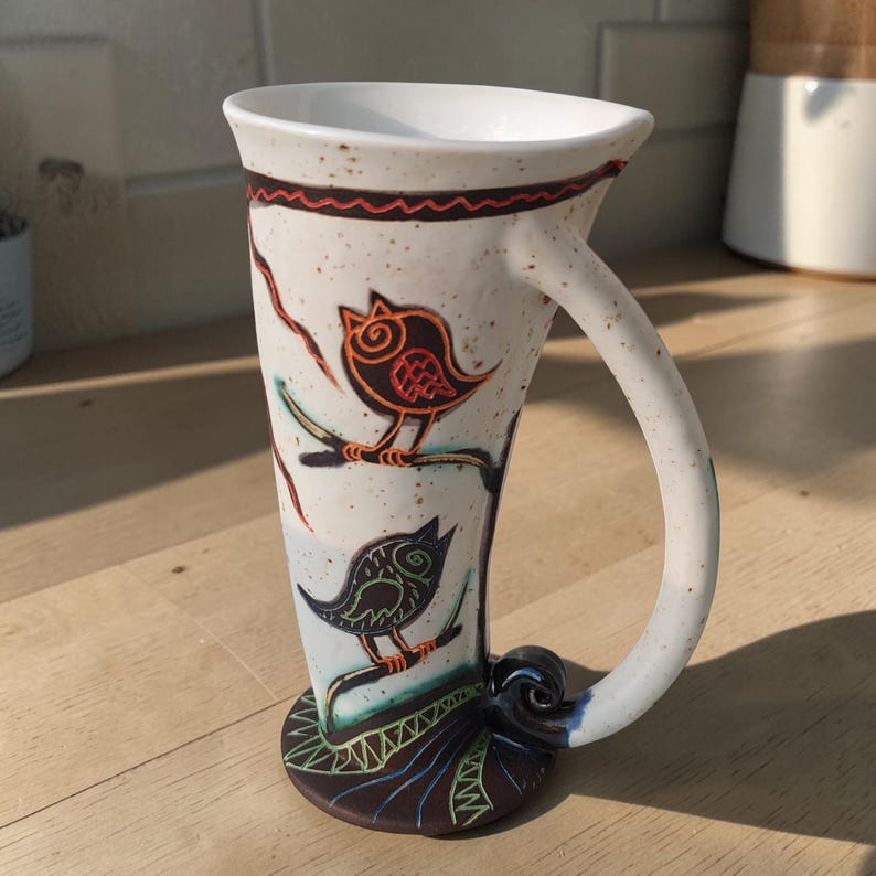 tall ceramic bird mug handmade pottery natural light kitchen scene