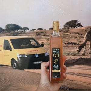 Moroccan argan oil bottle outdoor natural origin desert background