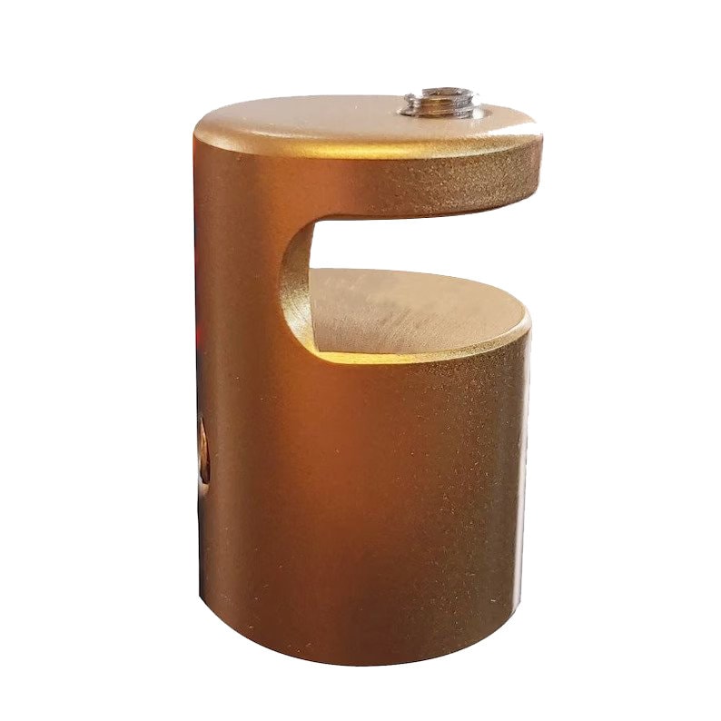 May include: A gold-colored, cylindrical metal object with a curved cutout. The top features a small, threaded component. The item has a smooth, metallic finish and is designed for a specific purpose, likely related to hardware or construction.