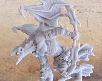 May include: A light gray, 3D-printed miniature of a fantasy creature, possibly a demon or dragon, with large wings, armor, and a sword. The figure is in a dynamic pose, suggesting movement, and is set against a neutral background.