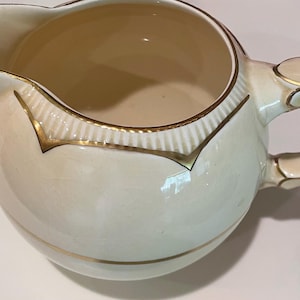 Early Clarice Cliff Staffordshire hand painted milk jug