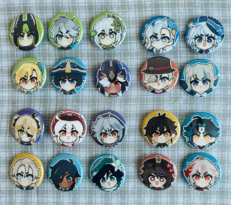 May include: A set of 18 round button pins featuring various anime characters with different expressions and poses. The buttons are colorful and feature a variety of characters with different hair colors, clothing, and accessories.