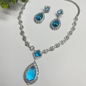 Faux Blue sky color pendant Necklace earring set zirconia diamond replica american diamond wedding engagement party wear gift fashion
