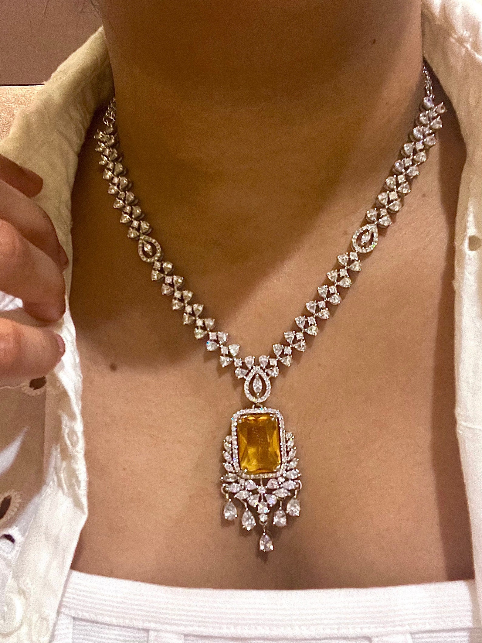 Atom knotted 14k white or 18k yellow gold finish cz necklace.