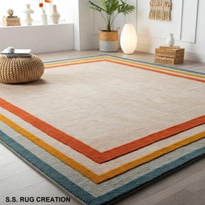 Tappeto in lana trapuntato a mano – colore crema, verde acqua, senape, bordo arancione