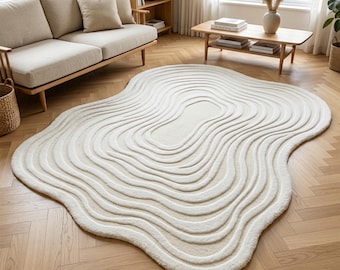 Modern krämfärgad matta med skulptural konturdesign för minimalistisk vardagsrumsinredning