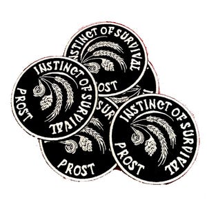 Puede incluir: Cinco parches redondos negros y blancos con el texto "Instinct of Survival" y "Prost" en un diseño circular. Cada parche presenta una imagen estilizada de espigas de trigo.
