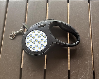 Rozkładana smycz z motywem uśmiechniętej łapki | Niebieska smycz dla psa z nadrukiem łapki