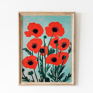 May include: A framed print of a painting featuring a cluster of red poppies with black centers against a light blue background.